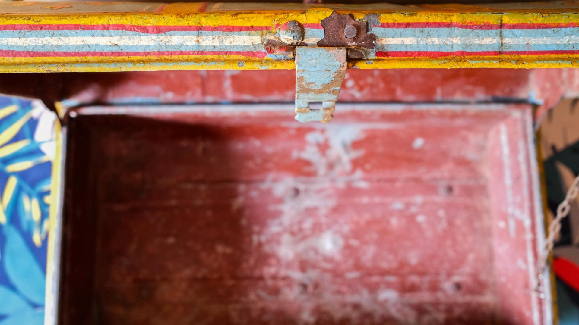 Close-up of a metal trunk with a rusty latch
