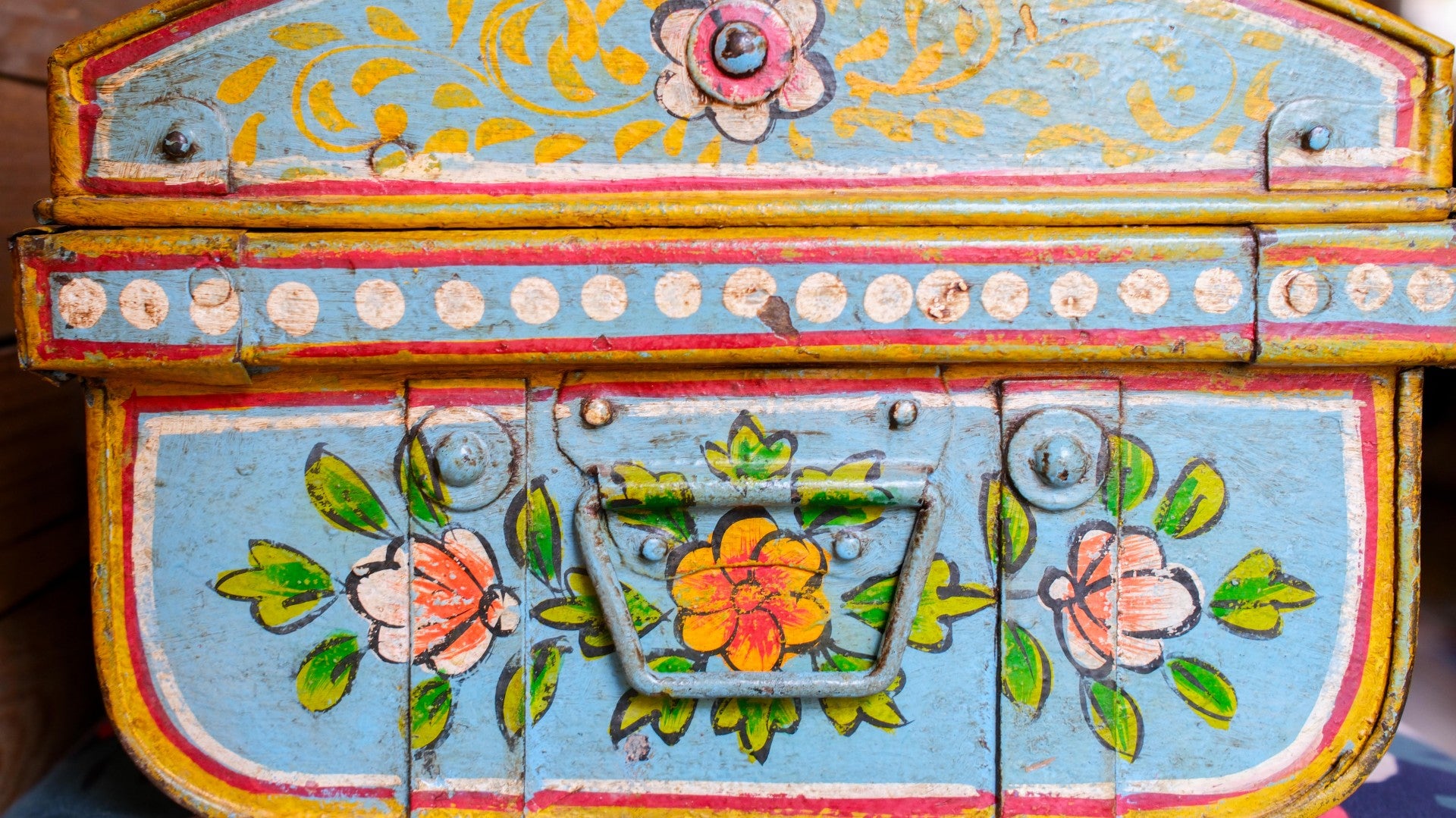 Decorative  metal trunk with floral patterns and colorful paint