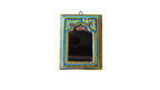 Decorative mirror with colorful frame on a wooden wall