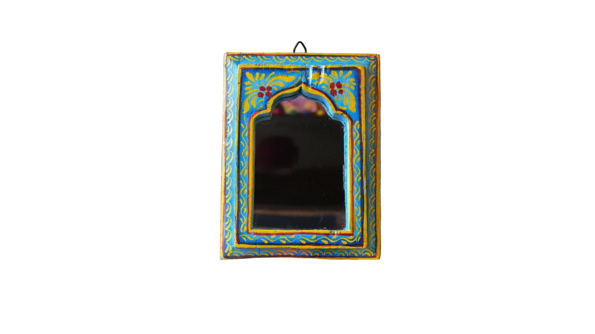 Decorative mirror with colorful frame on a wooden wall