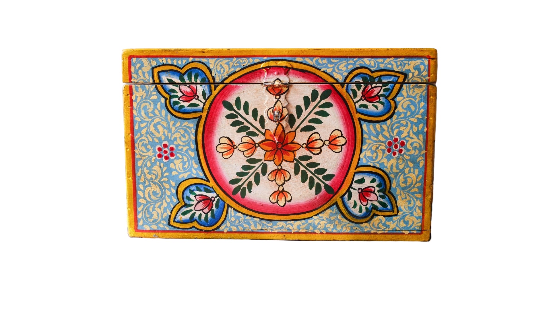 Decorative box with floral patterns on a wooden surface