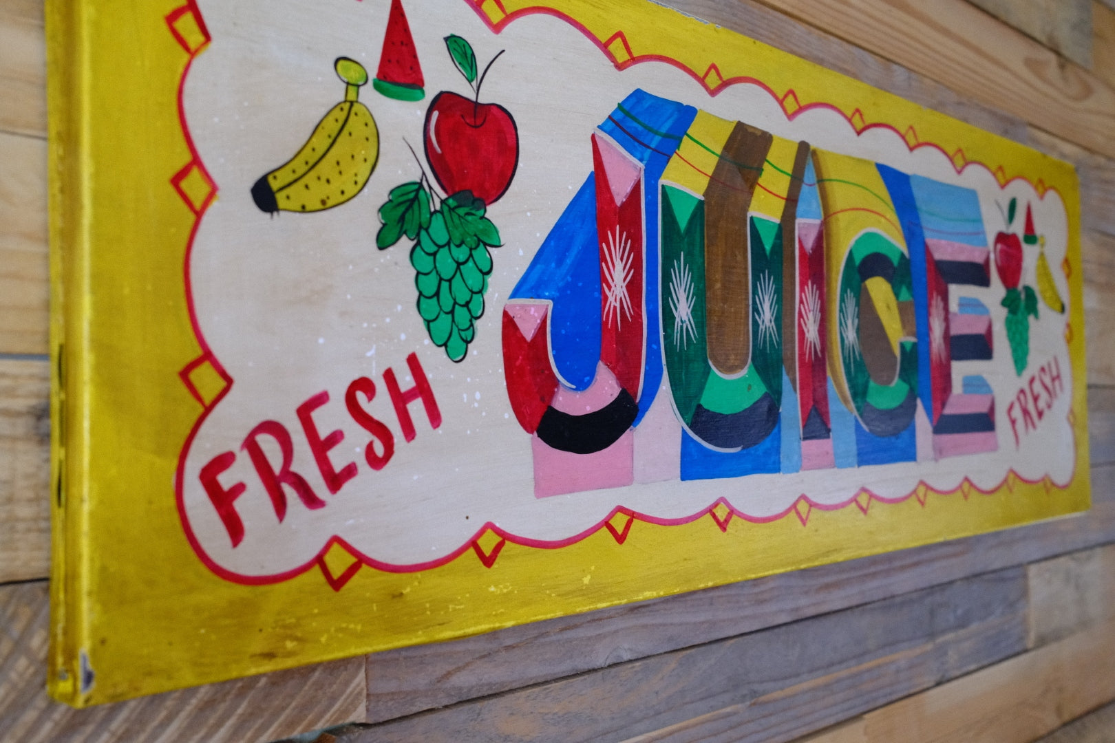 Colorful hand painted juice sign 