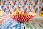 Pink zig-zag patterned bamboo basket handwoven with natural fibres