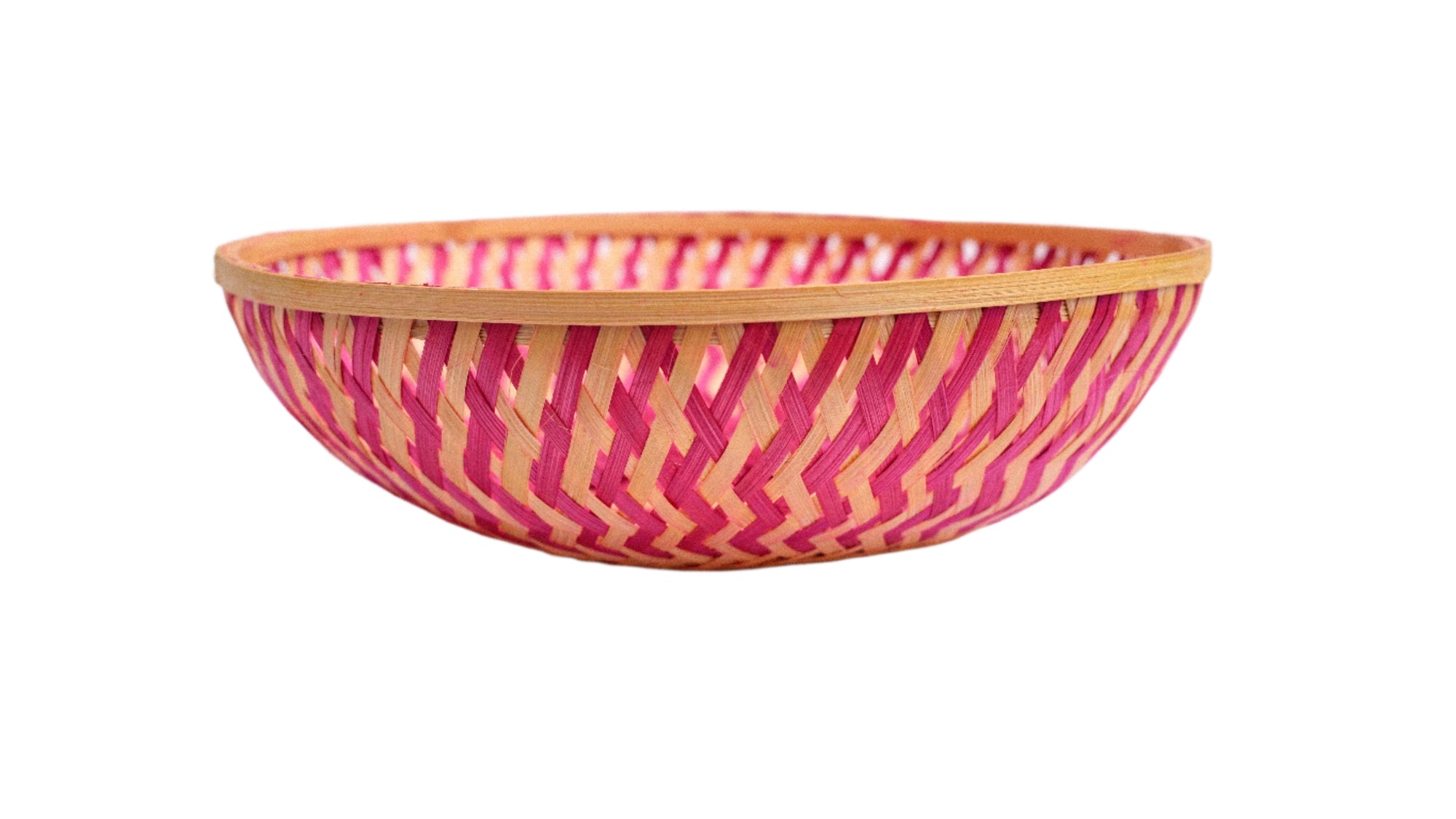 Woven bamboo bowl with pink pattern on a white background