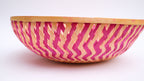 Pink zig-zag patterned bamboo basket handwoven with natural fibres