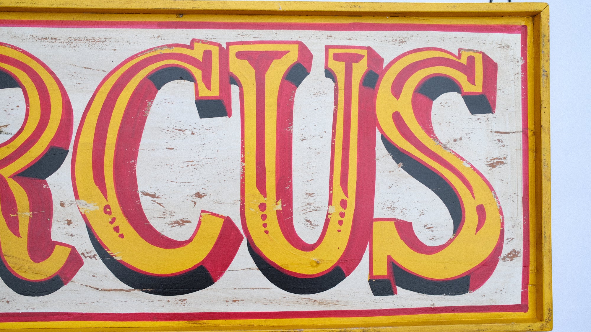 Vintage-style sign with the word 'Circus' in large, colorful letters.