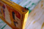 Close-up of a wooden rustic love sign and hanging detail 