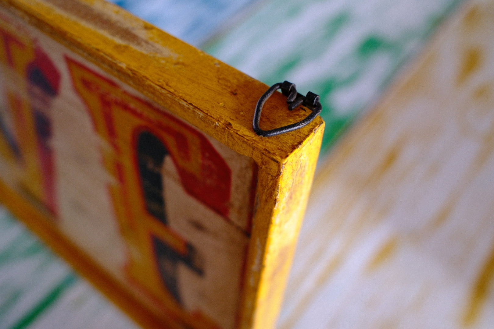 Close-up of a wooden rustic love sign and hanging detail 