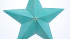 Turquoise rustic barn star-shaped decorative item on a white background