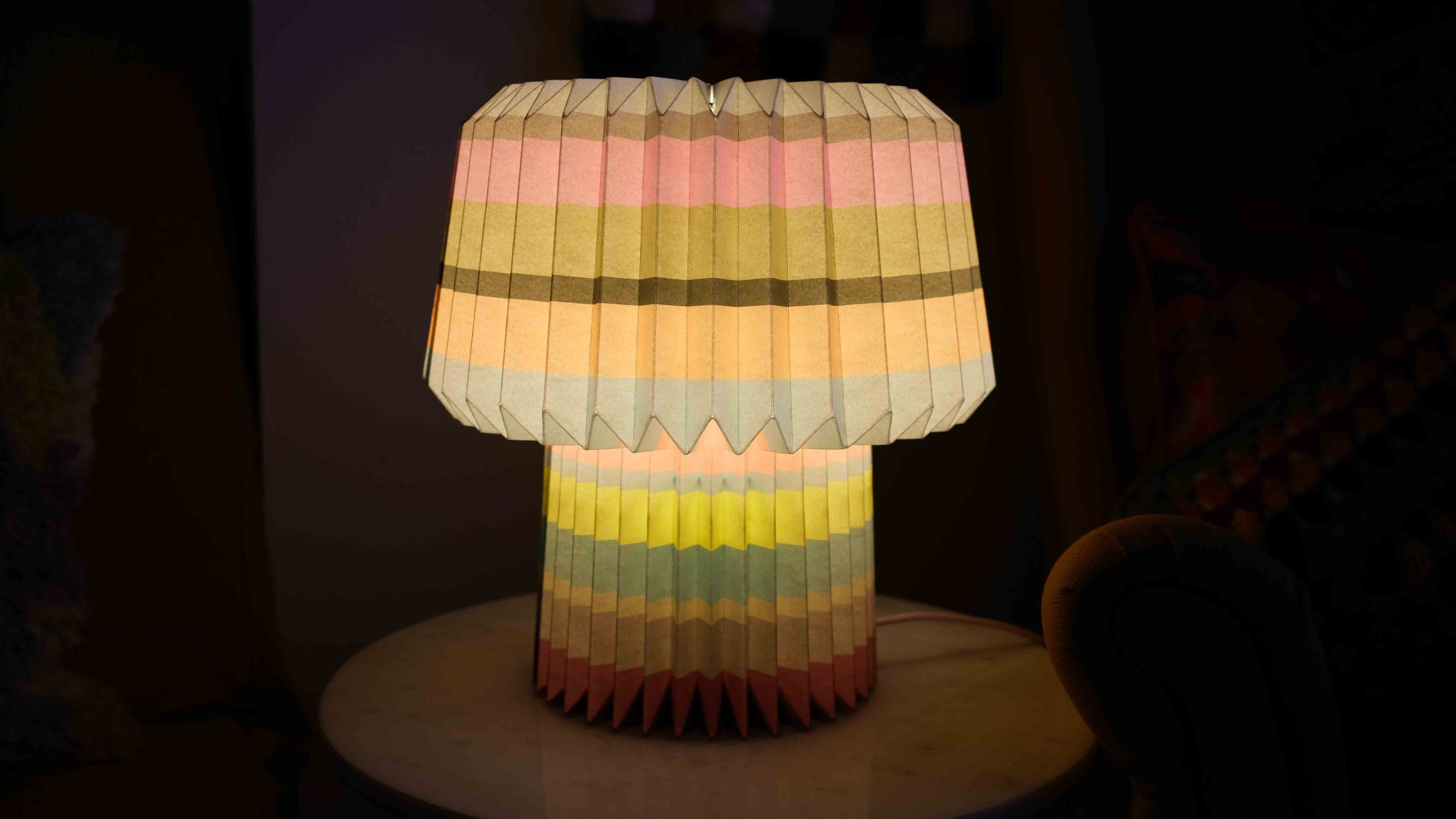 Colorful pleated lampshade on a dark background